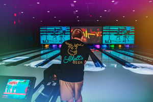 Man Bowling at Union Social with his friends